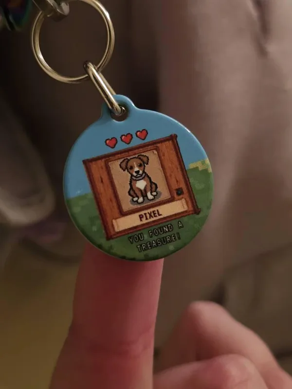 Buyer photo: round pixel-art tag with a brown and white puppy portrait and the name Pixel